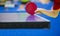 Close up of a woman hands holding table tennis rocket and ball