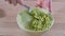 Close-up Of Woman Hands Mashing Avocado With Fork In Bowl.