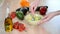 Close-up Of Woman Hands Mashing Avocado With Fork In Bowl.