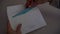 Close up for woman hands opening the envelope and taking the ticket and the document out. Female hands taking from the