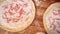 Close up of woman hands preparing fresh dough pizza base