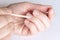 Close-up of woman hands removing cuticle