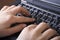 Close up of woman hands typing in the laptop compu