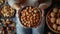 Close-Up of Woman Holding Bowl of Almonds