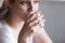 Close up woman holding glass drink water