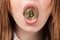 Close up of a woman holding golden bitcoin