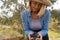 Close-up of woman holding harvested olives in farm