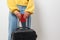 Close-up woman holding a passport and travel bag in her hands. Travel, immigration, emigration