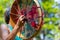 Close up of woman holding sacred drum