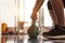 Close up of woman lifting kettlebell like dumbbells in fitness sport club gym training center with sport equipment near window