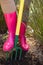 Close-up of woman loosening soil with garden fork