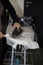 Close-up Of woman Maid Ironing Clothes On Ironing Board at home