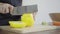 Close up of woman making healthy food and chopping bell pepper on cutting board