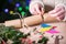 Close Up Of Woman Making Homemade Eco Friendly Christmas Cracker From Sustainable Materials