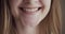 Close-up woman mouth smiling with beautiful soft lips.