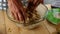 Close up of woman old mature hands prepare a tasty hand home made fruit pie for people at home - celebration together - grandmothe
