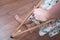 Close-up, a woman picks up a crutch, leans on it and walks. Rehabilitation after removal of plaster bandage.