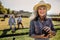 Close up of a woman playing boules in a lawn