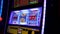 Close up woman playing slot machine