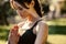 Close up of woman practicing yoga with her hands joined. Fitness female meditating outdoors at the park in morning