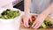 Close up on a woman preparing a salad