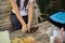 Close-up of woman preparing trash for recycling, squeezes an empty bottle. Woman caring for nature. Different colours of