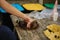 Close-up of woman preparing trash for recycling, squeezes an empty bottle. Woman caring for nature. Different colours of