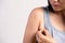 Close up woman pulling her skin underarm. problem armpit fat skin concept