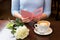 Close up of woman reading greeting card and coffee