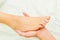 Close-up of a woman receiving foot massage from a male therapist