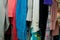Close up of woman\'s clothing hanging in closet