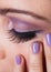 Close-up Of Woman\'s Eye With Purple Eyeshadow