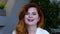 Close up of woman\'s face, woman laughs, attractive ginger.