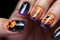 Close up of woman\\\'s fingernails with Halloween nail art