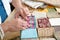 Close up of woman\'s hand sewing patchwork