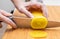 Close up of woman`s hand slicing Korean yellow pickled radish. Traditional food of Korea