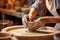 Close-up of a woman\\\'s hands in a ceramic workshop working with clay on a potter\\\'s wheel. Generative AI