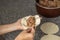 Close up of woman`s hands filling an Argentine meat empanada