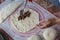 Close up of a woman`s hands making dough for homemade bread, baker preparing bread on a silicone baking sheet