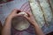 Close up of a woman`s hands making dough for homemade bread on a silicone baking sheet