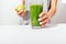 Close-up of woman\'s hands with manicure holding apple