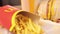 Close-up woman\\\'s hands take french fries, selective focus