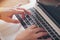 Close up of woman`s hands using computer keyboard. Enterprising woman, use of technology