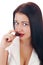 Close up of woman\'s lips biting a bar of chocolate