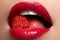 Close-up of woman\'s lips with bright fashion red glossy makeup