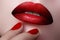 Close-up of woman\'s lips with fashion make-up and manicure. Beau