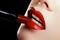 Close-up of woman`s lips with fashion red make-up. Beautiful female mouth, full lips with perfect makeup