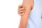 Close up woman scratch hand on white background. itchy skin arm body. authentic slim shape and skin tan girl. care medical for