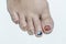 Close up woman short toenail painting multicolor gel nails art in coronavirus 19 concept
