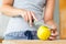 Close up of woman slicing apple